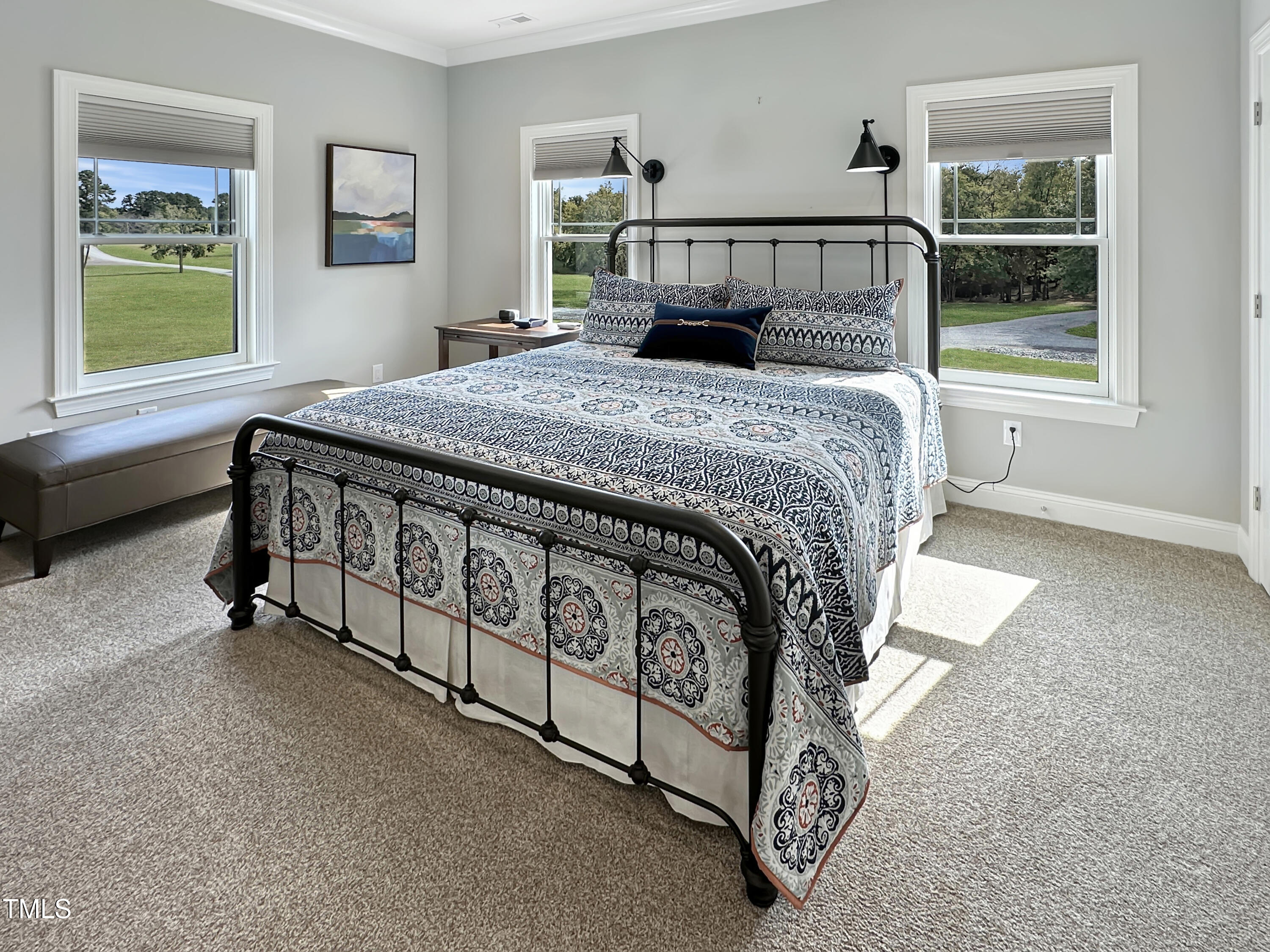 8589 McGhees Mill Road Semora, NC 27343 - Photo 28 of 67 a bed sitting in a bedroom next to a window