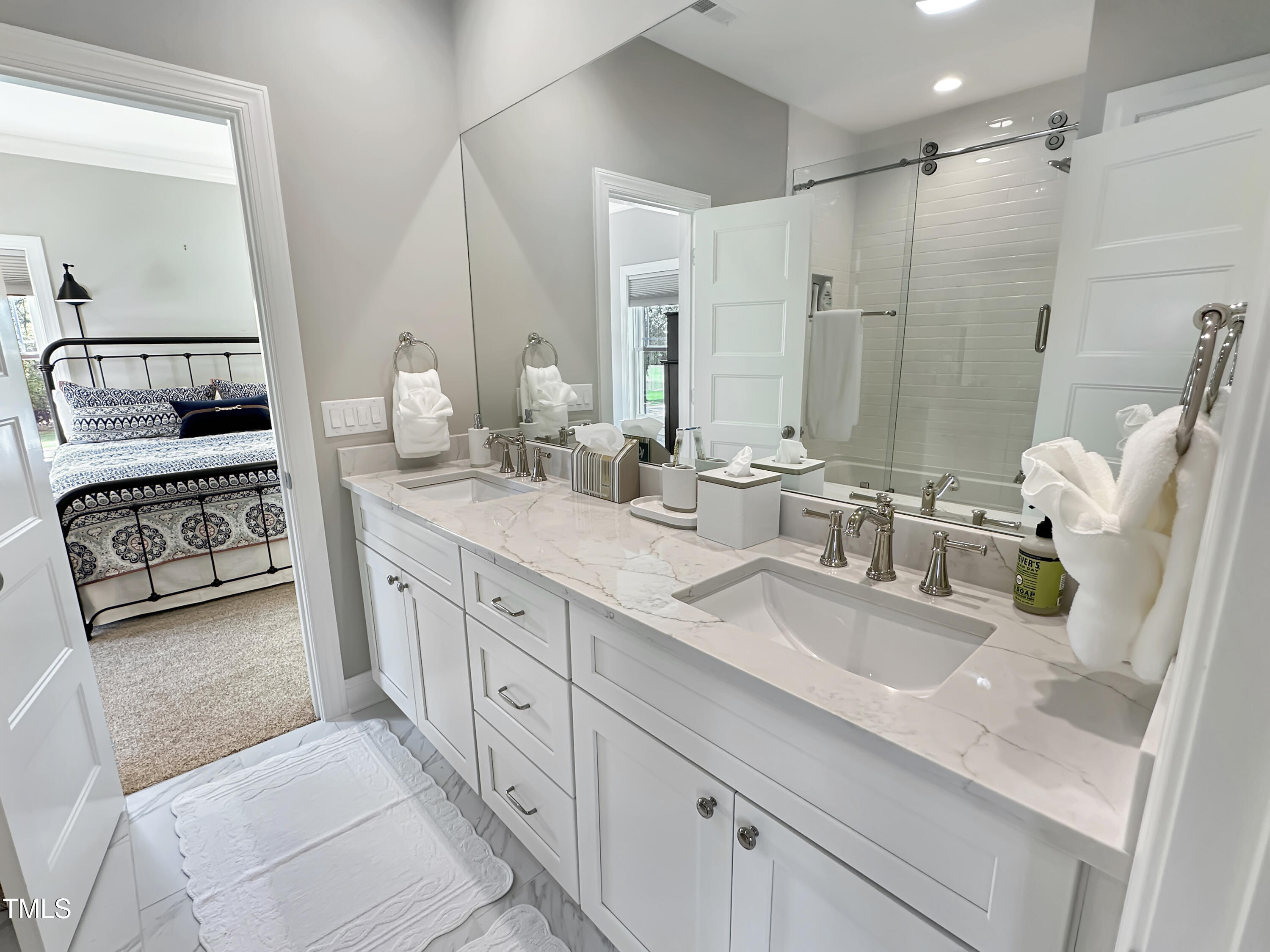 8589 McGhees Mill Road Semora, NC 27343 - Photo 29 of 67 a spacious bathroom with double sink and a mirror