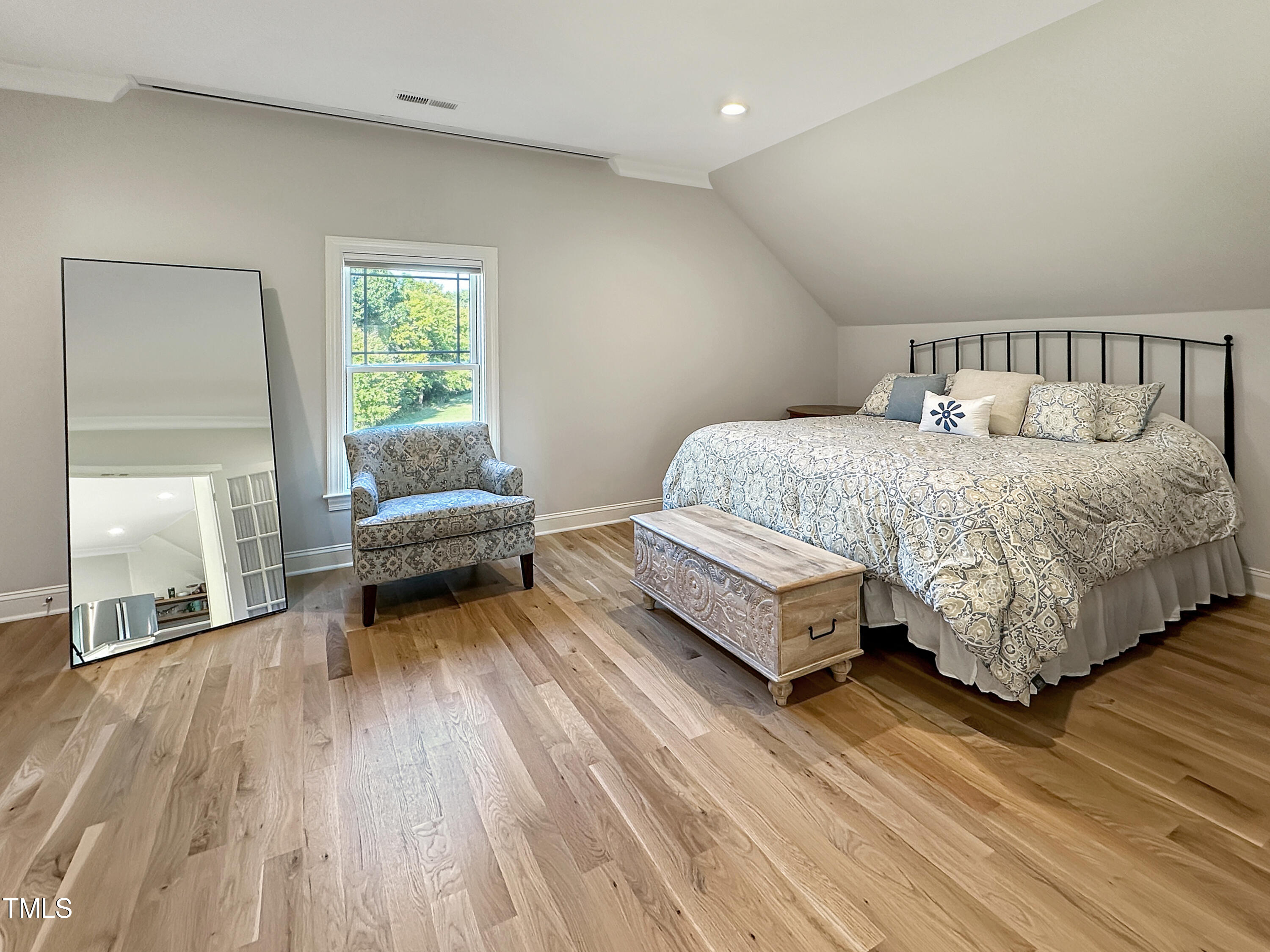 8589 McGhees Mill Road Semora, NC 27343 - Photo 33 of 67 a spacious bedroom with a bed and a window