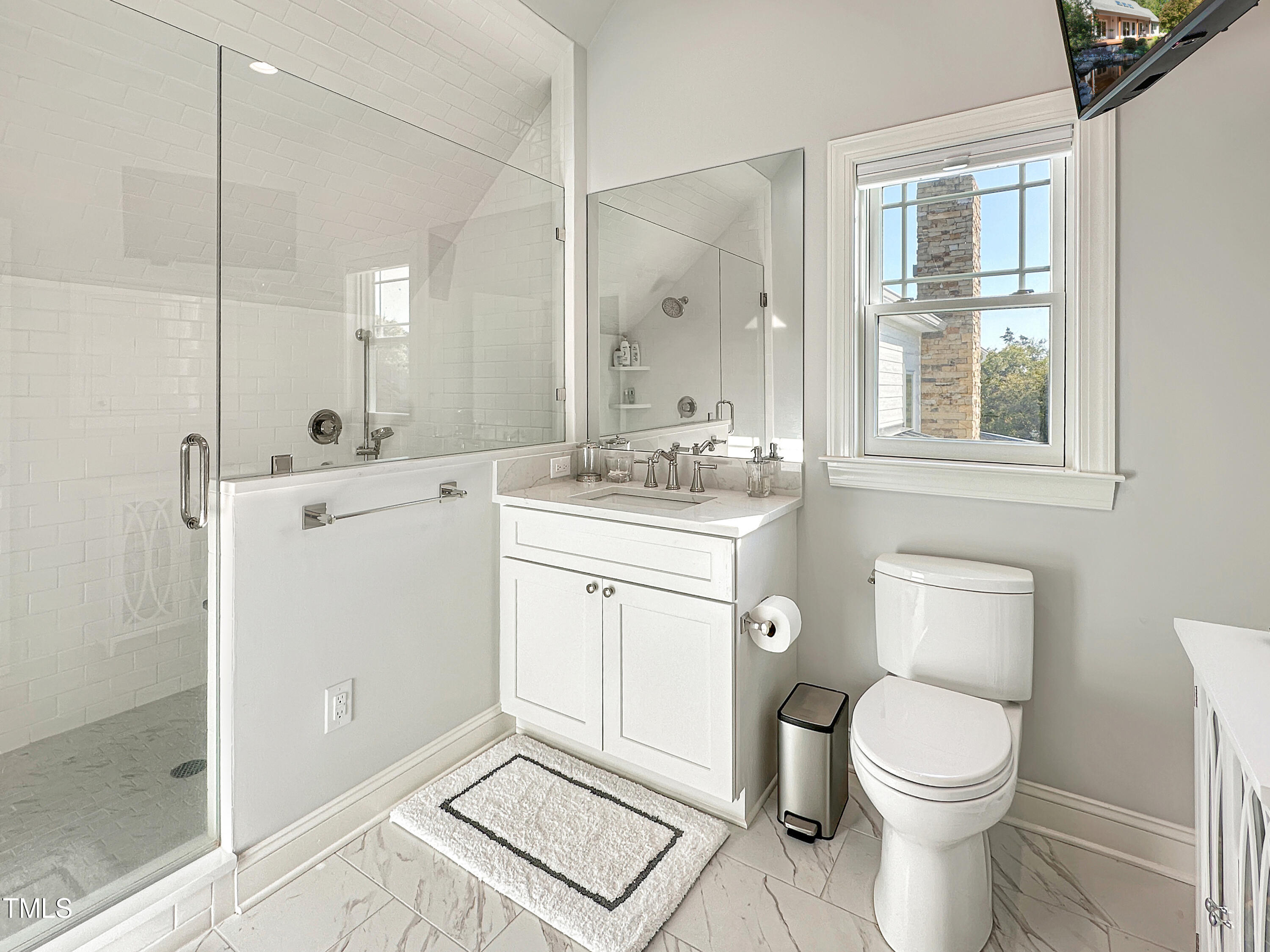 8589 McGhees Mill Road Semora, NC 27343 - Photo 35 of 67 a bathroom with a toilet sink and a mirror