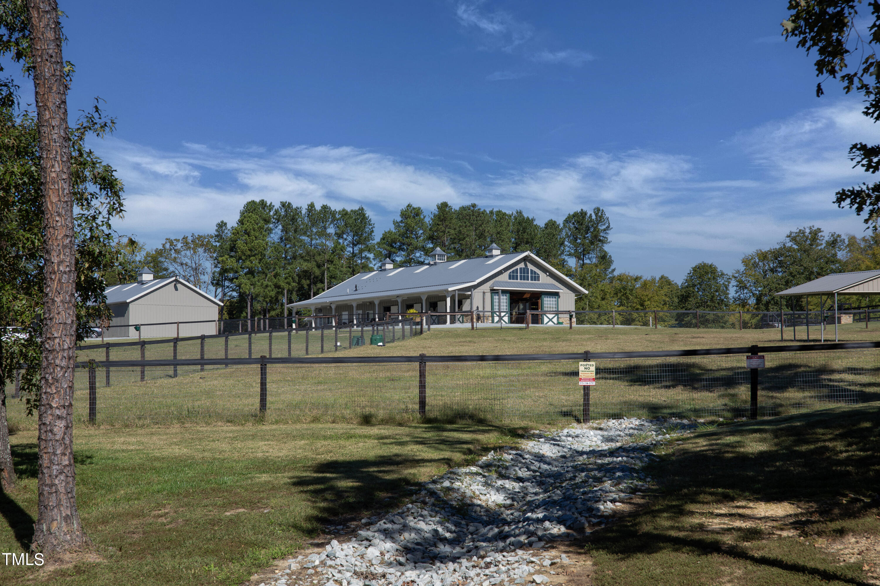 8589 McGhees Mill Road Semora, NC 27343 - Photo 37 of 67 a view of a big house with a big yard and large tree