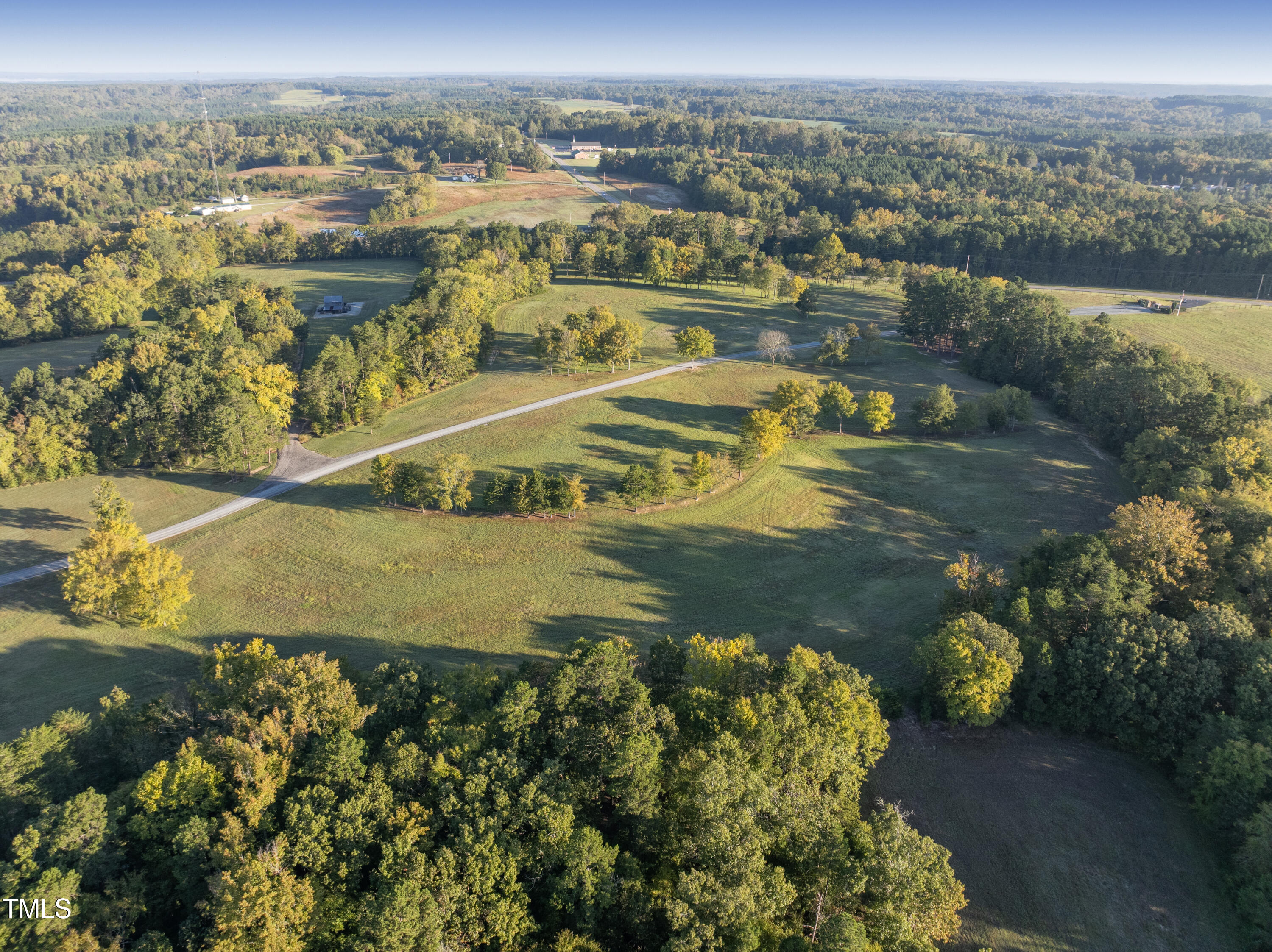 8589 McGhees Mill Road Semora, NC 27343 - Photo 5 of 67 an aerial view of residential houses with outdoor space