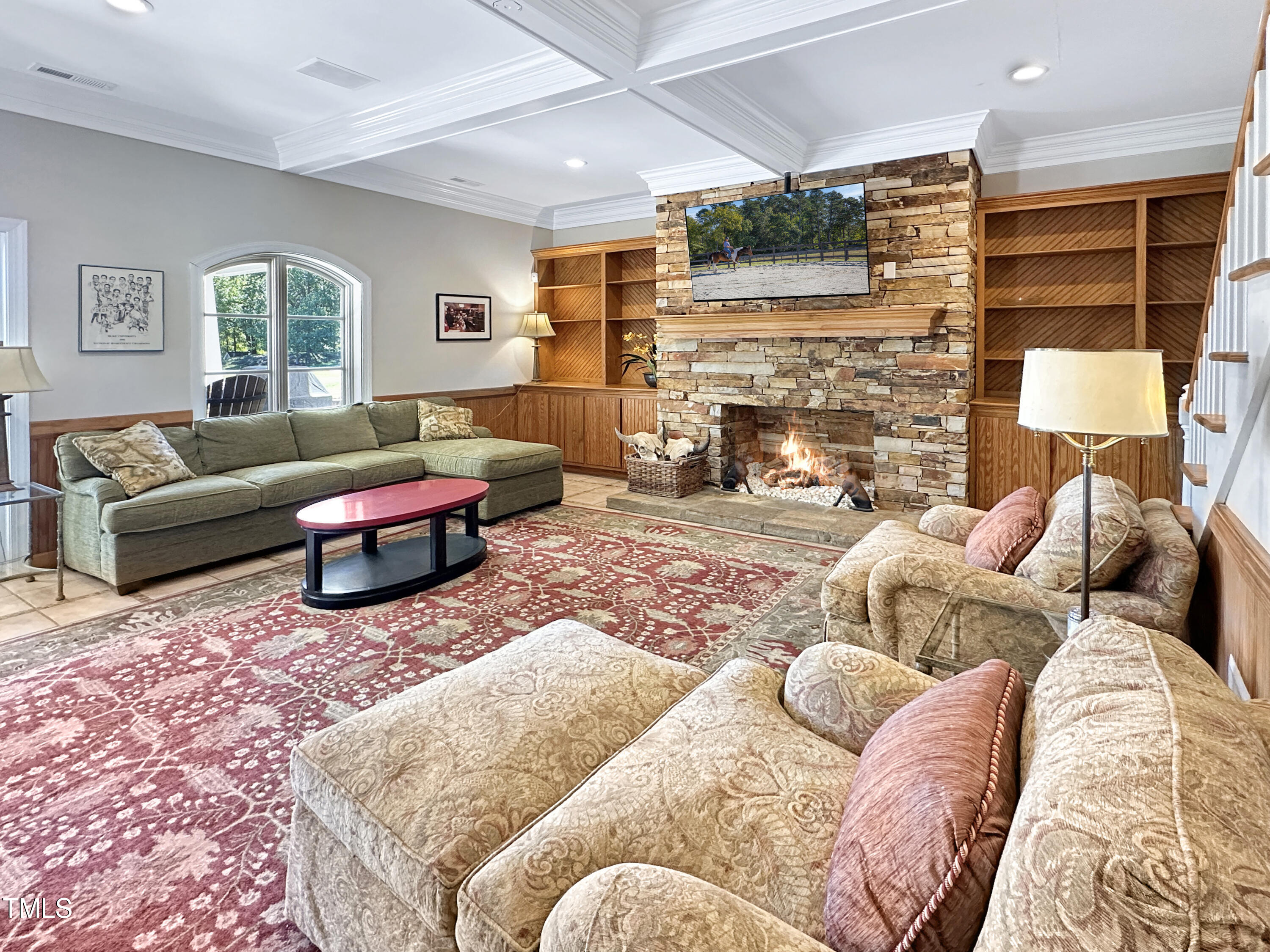 8589 McGhees Mill Road Semora, NC 27343 - Photo 61 of 67 a living room with furniture a fireplace and a flat screen tv