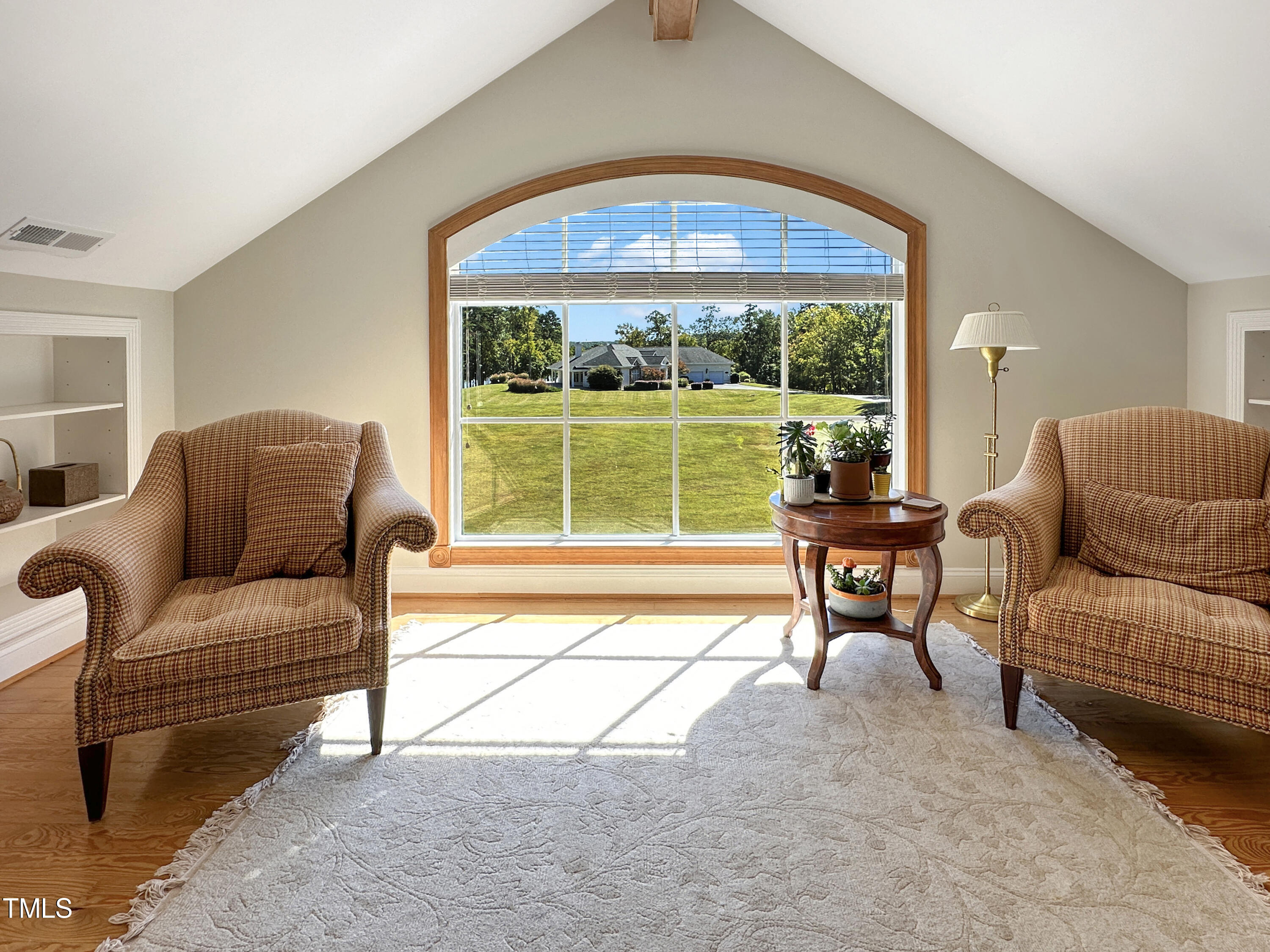 8589 McGhees Mill Road Semora, NC 27343 - Photo 63 of 67 a living room with furniture and a large window