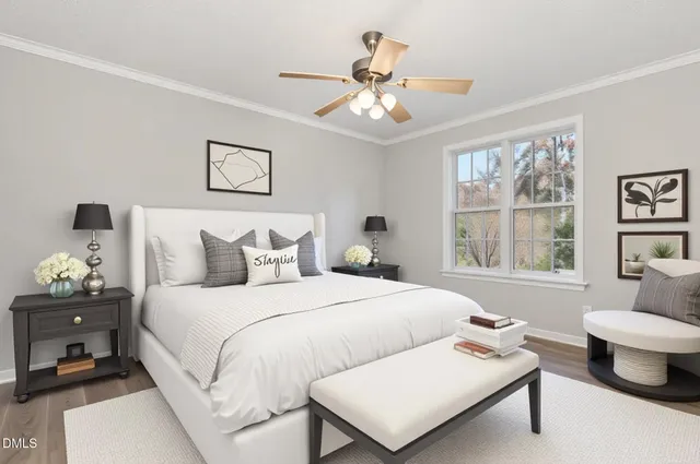 an empty room with wooden floor chandelier fan and windows