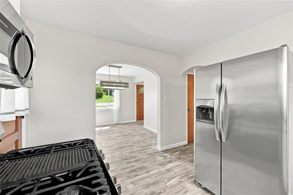 545 Center Hill Road Pittsburgh, PA 15239 - Photo 23 of 48 An arched opening connects the kitchen to the dining area for easy entertaining.