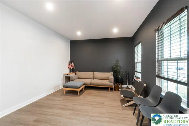 a view of a hallway with paintings on the wall