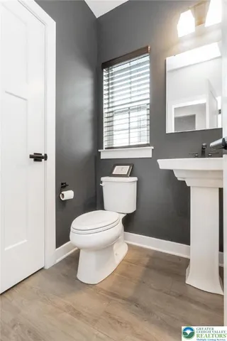 a bedroom with a bed and a tv