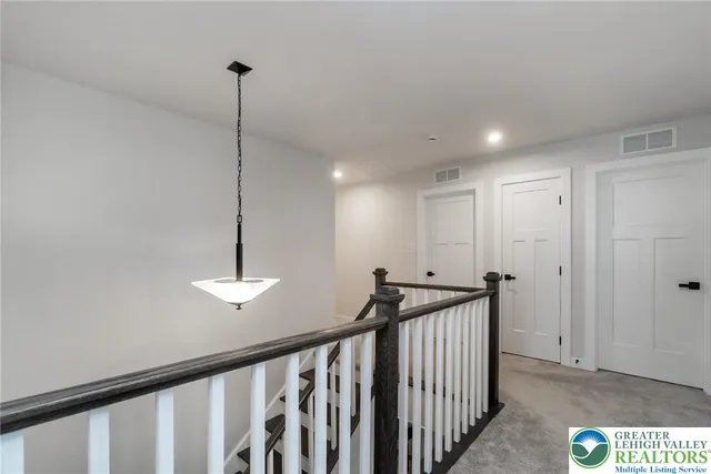 a bedroom with a bed and a night stand