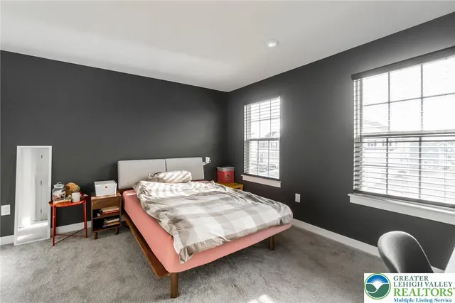 a bathroom with a sink vanity and a mirror