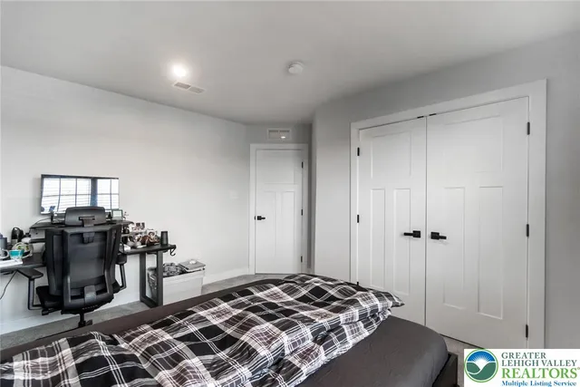 a bathroom with a sink toilet a mirror and shower