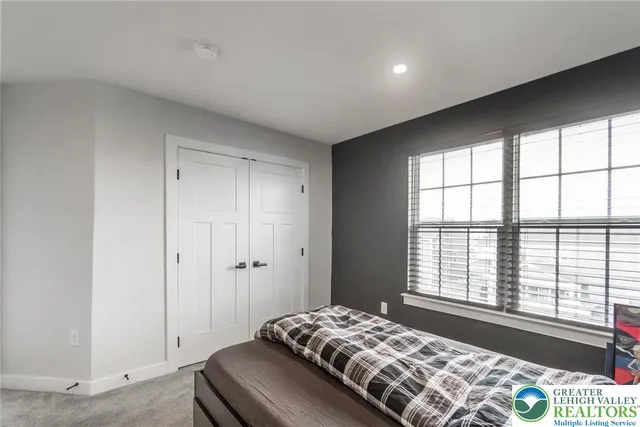 a view of a room with furniture and white walls