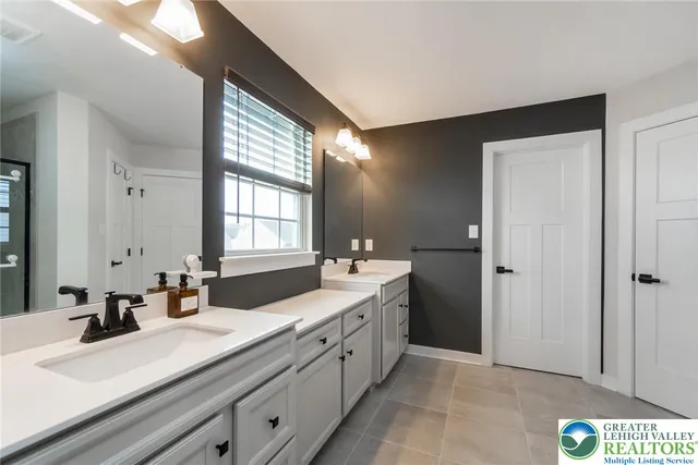 a living room with furniture and a view of kitchen