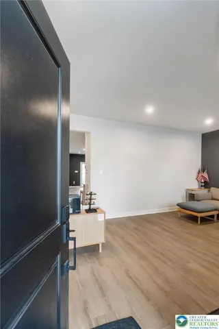a large white kitchen with sink and white cabinets