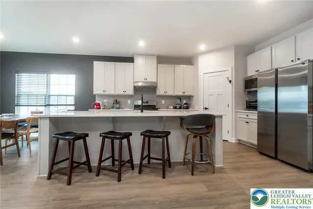 a view of kitchen with cabinets and wooden floor