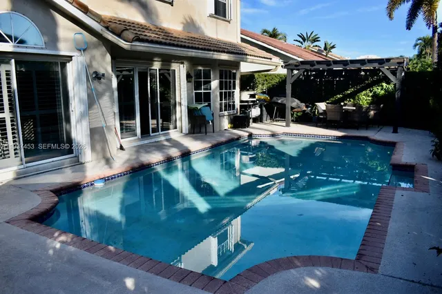 a view of a balcony with furniture and wooden floor