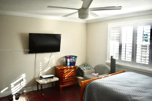 a front view of a house with a potted plants