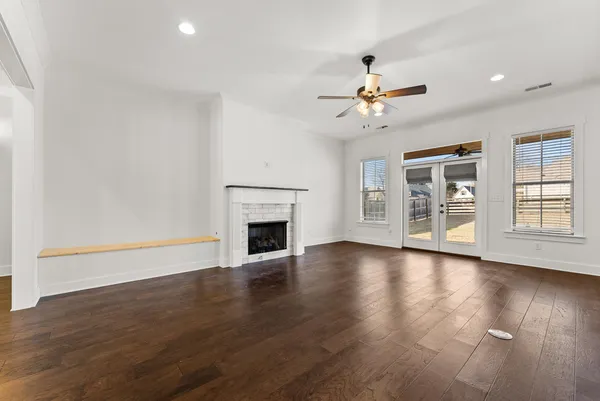 a view of kitchen with furniture and wooden floor