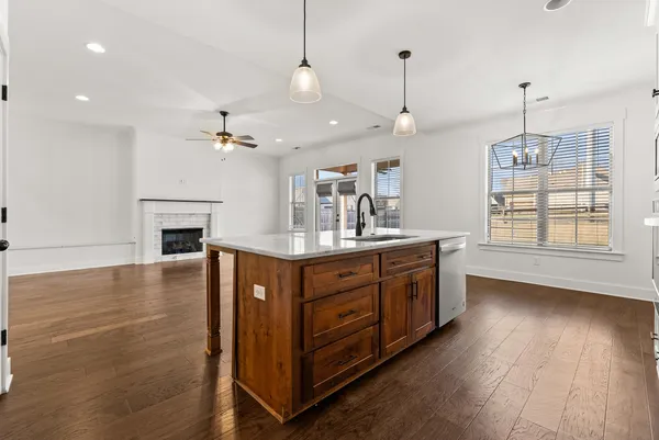 a kitchen with stainless steel appliances granite countertop a stove and a sink