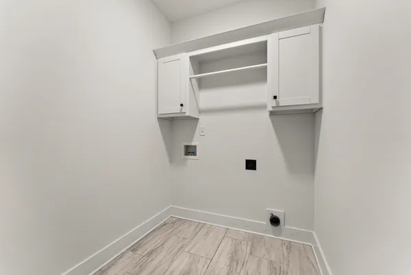 a kitchen with stainless steel appliances granite countertop a stove a sink and a wooden floor
