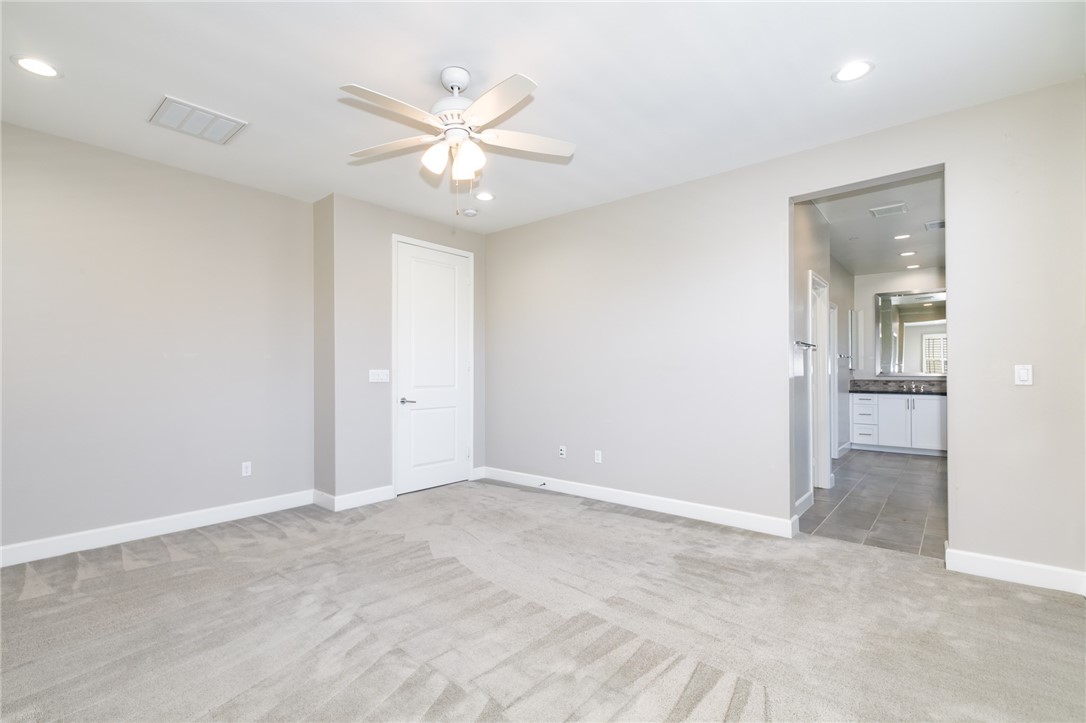 155 Blue Crystal Drive Walnut, CA 91789 - Photo 8 of 14 an empty room with fan and a ceiling fan