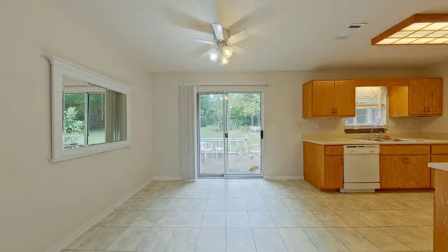 a view of a kitchen with a sink dishwasher and a microwave