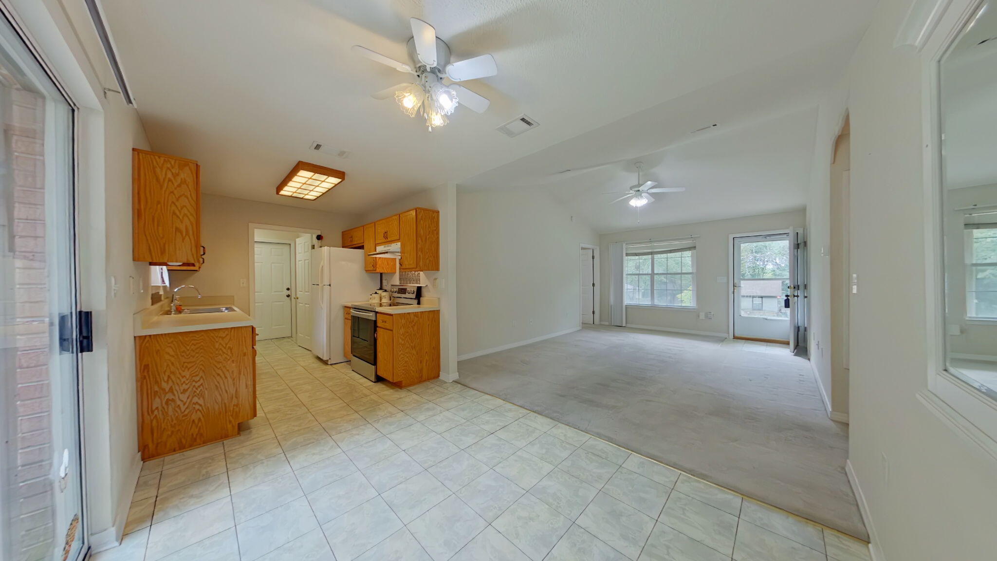 117 Jeff Drive Crestview, FL 32536 - Photo 12 of 33 a view of a kitchen with furniture and an empty room