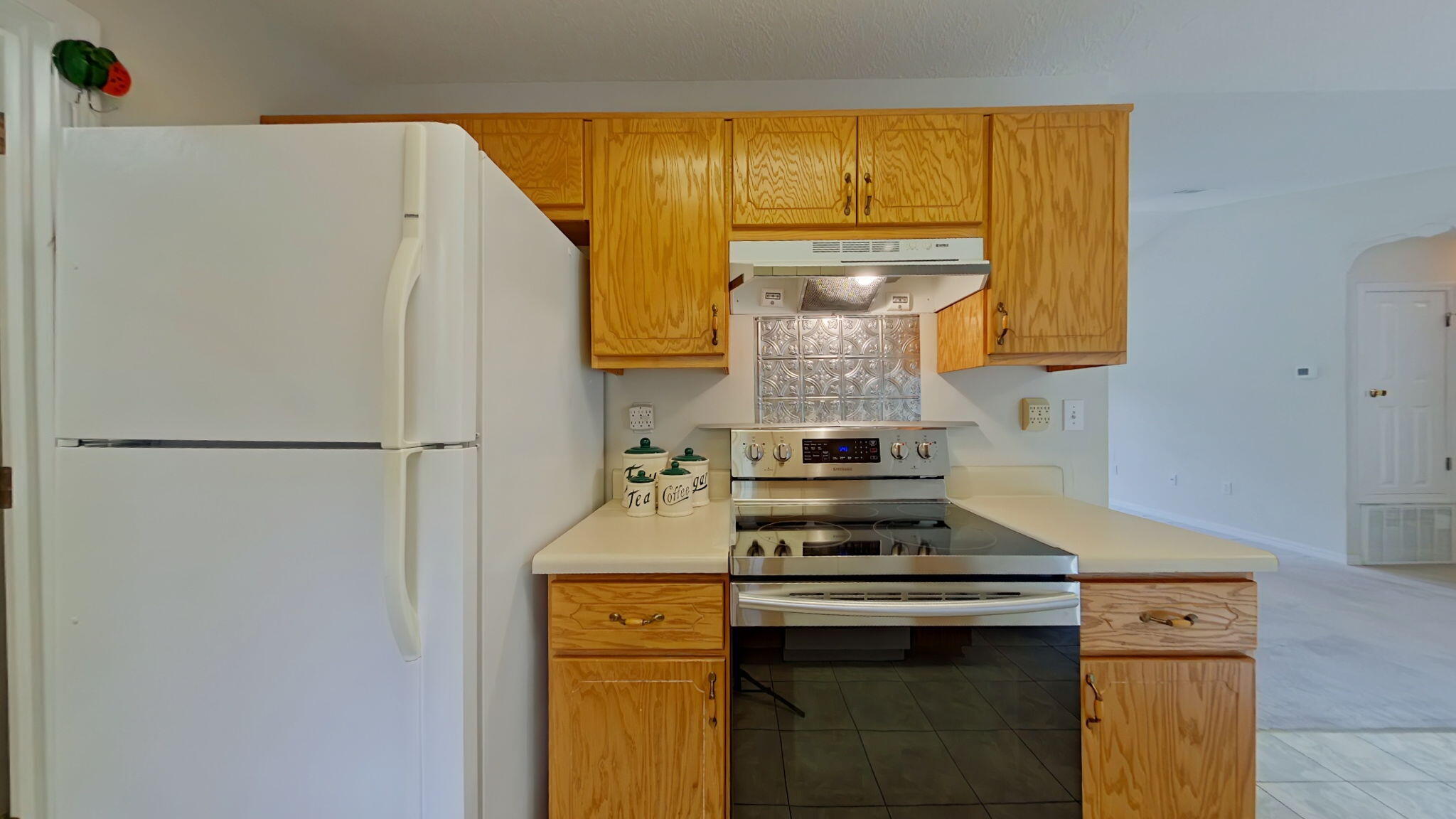 117 Jeff Drive Crestview, FL 32536 - Photo 15 of 33 a kitchen with a stove and a refrigerator