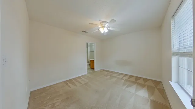 a view of empty room with fan