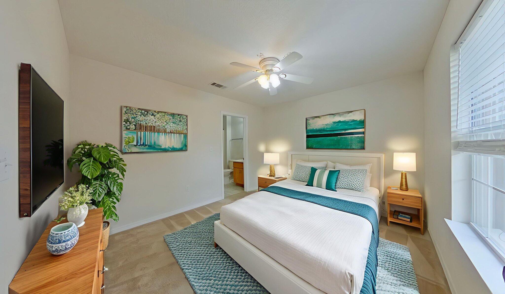 117 Jeff Drive Crestview, FL 32536 - Photo 17 of 33 a bedroom with a bed and a potted plant