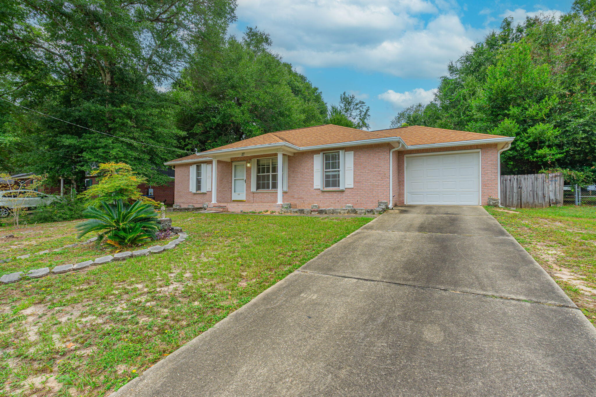 117 Jeff Drive Crestview, FL 32536 - Photo 2 of 33 a front view of a house with garden