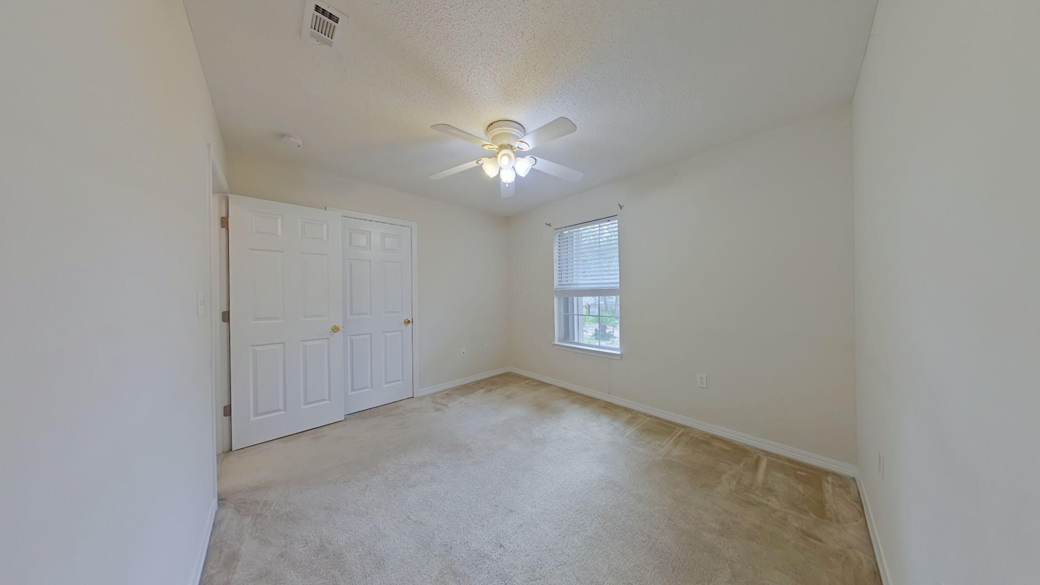 117 Jeff Drive Crestview, FL 32536 - Photo 23 of 33 a view of room with a ceiling fan and window