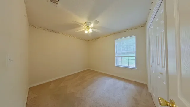 a view of empty room with windows
