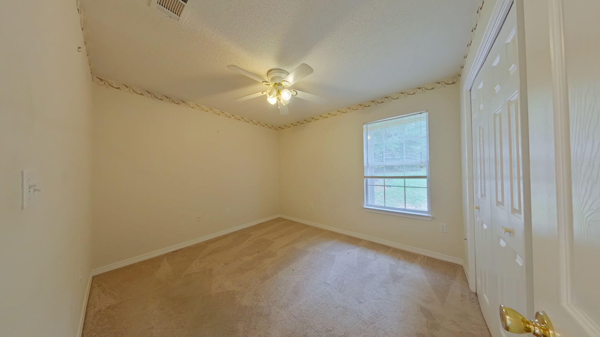 117 Jeff Drive Crestview, FL 32536 - Photo 25 of 33 a view of empty room with windows