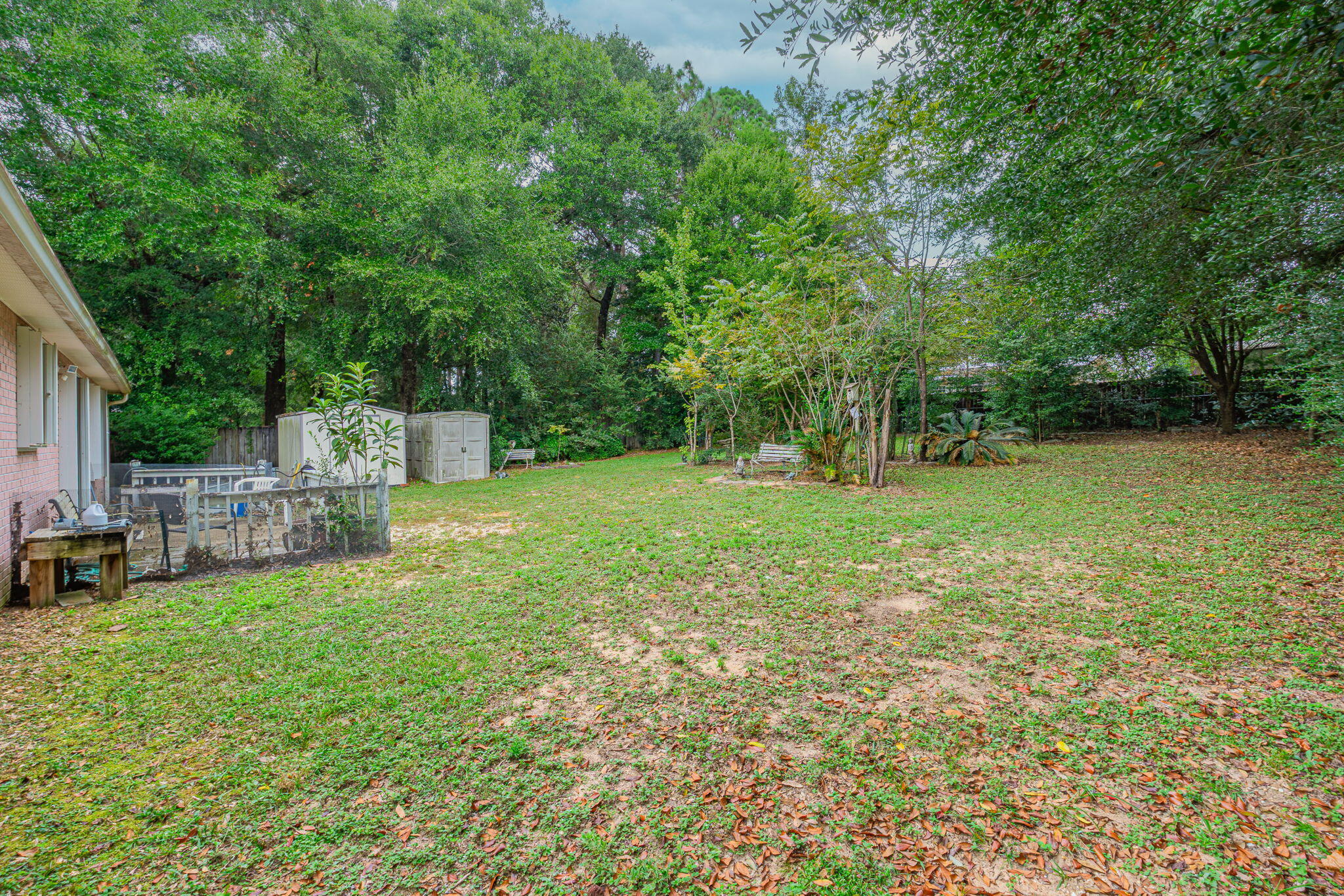 117 Jeff Drive Crestview, FL 32536 - Photo 27 of 33 a view of a backyard with a garden