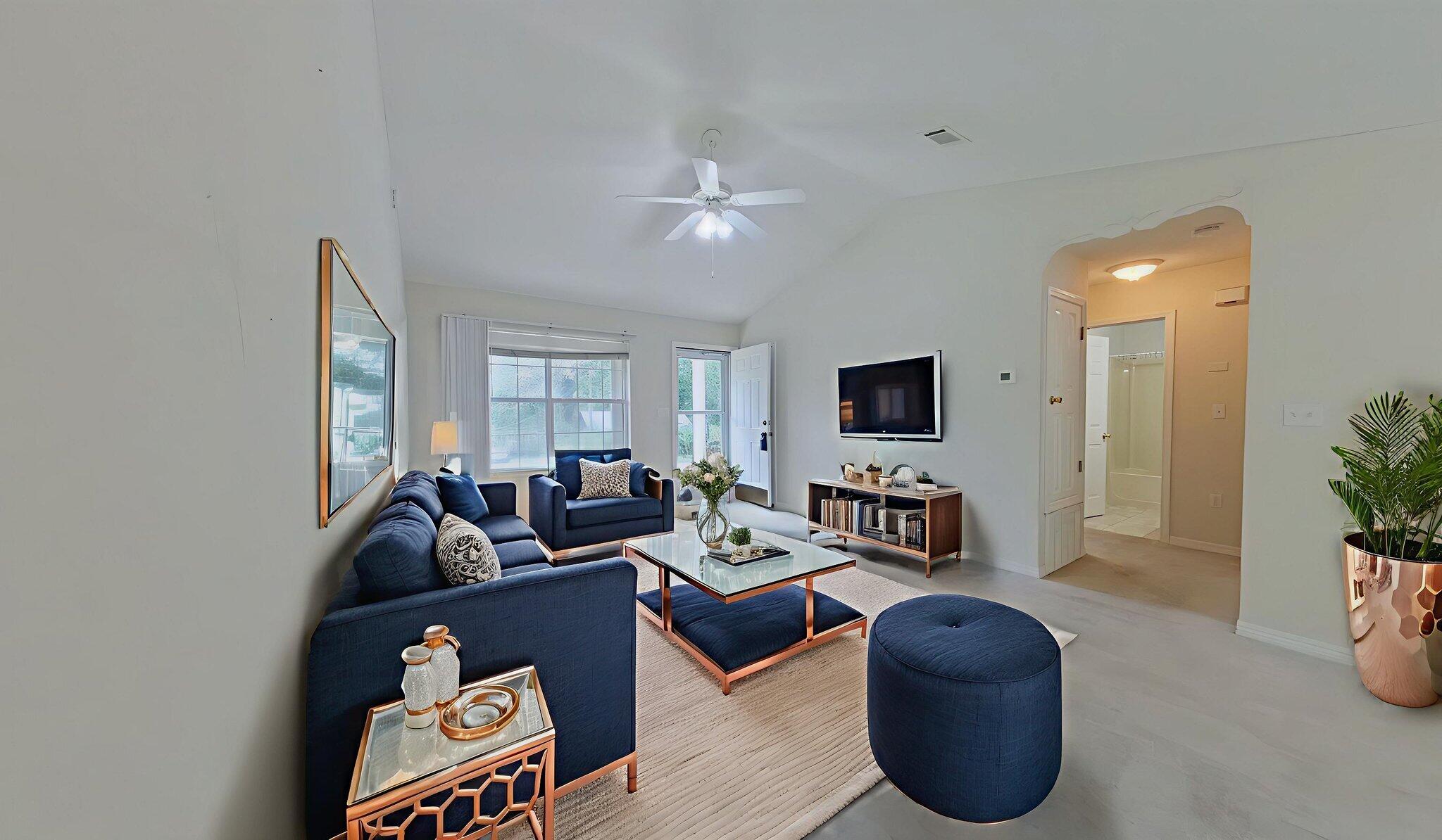 117 Jeff Drive Crestview, FL 32536 - Photo 6 of 33 a living room with furniture a flat screen tv and a large window
