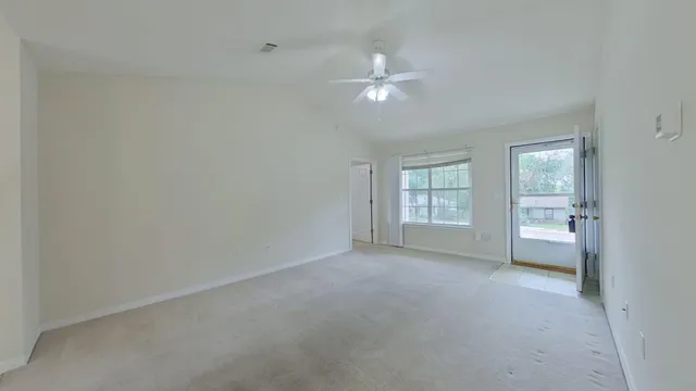 a view of an empty room with a window