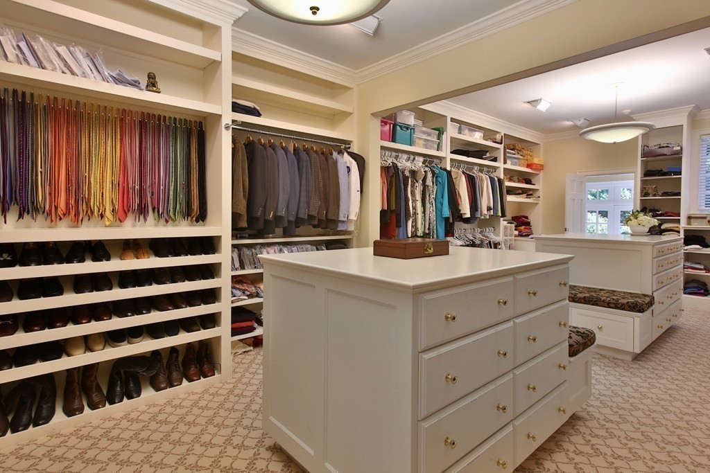 466 Glen Road Weston, MA 02493 - Photo 12 of 27 a view of walk in closet with clothes and shoes