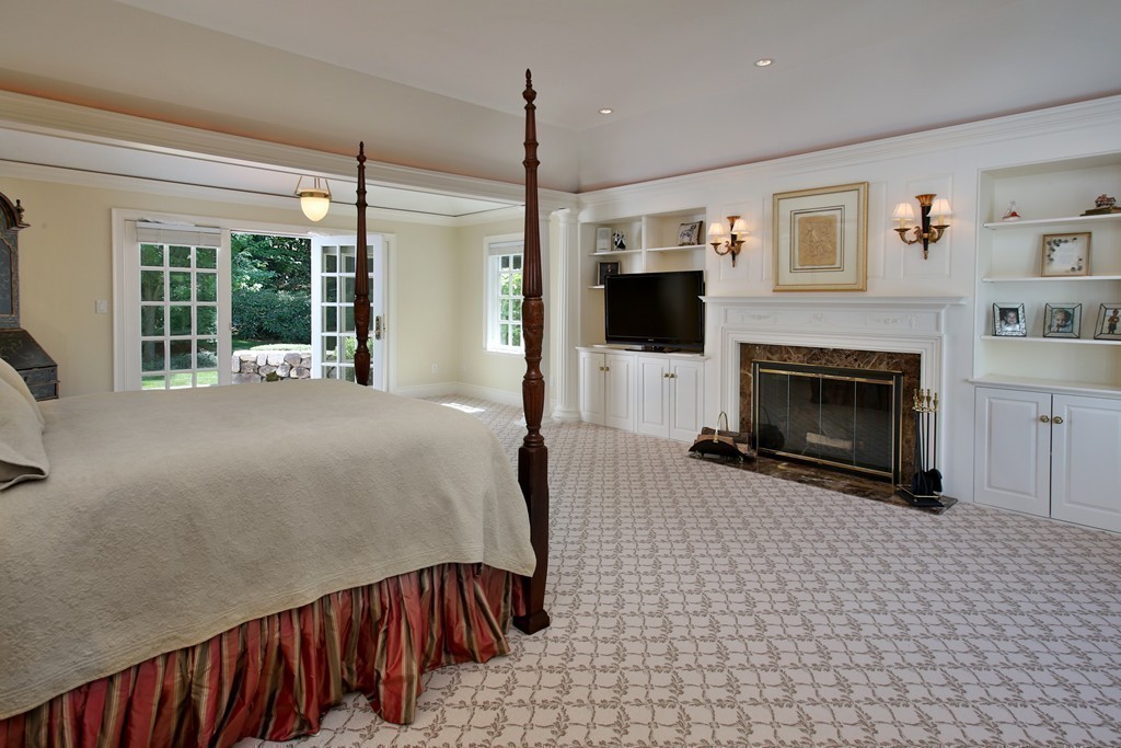 466 Glen Road Weston, MA 02493 - Photo 14 of 27 a living room with furniture and a fireplace