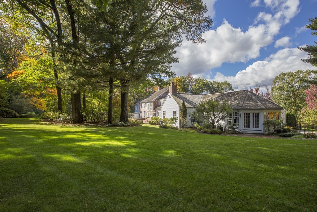 466 Glen Road Weston, MA 02493 - Photo 18 of 27 a front view of a house with a garden