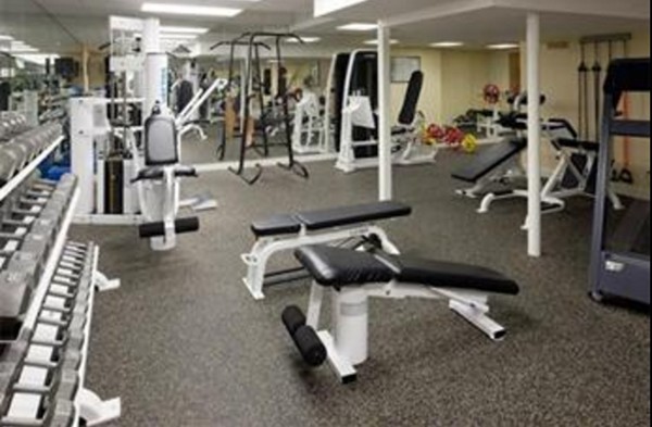 466 Glen Road Weston, MA 02493 - Photo 22 of 27 a gym room that has a lots off gym equipment