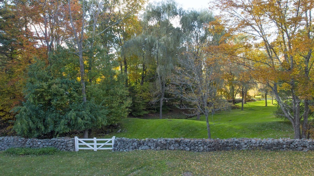 466 Glen Road Weston, MA 02493 - Photo 24 of 27 a view of a golf course with a lake