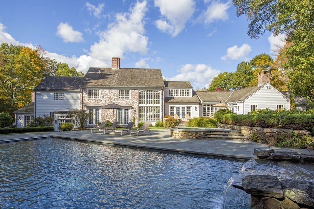 466 Glen Road Weston, MA 02493 - Photo 3 of 27 a front view of a house with a yard