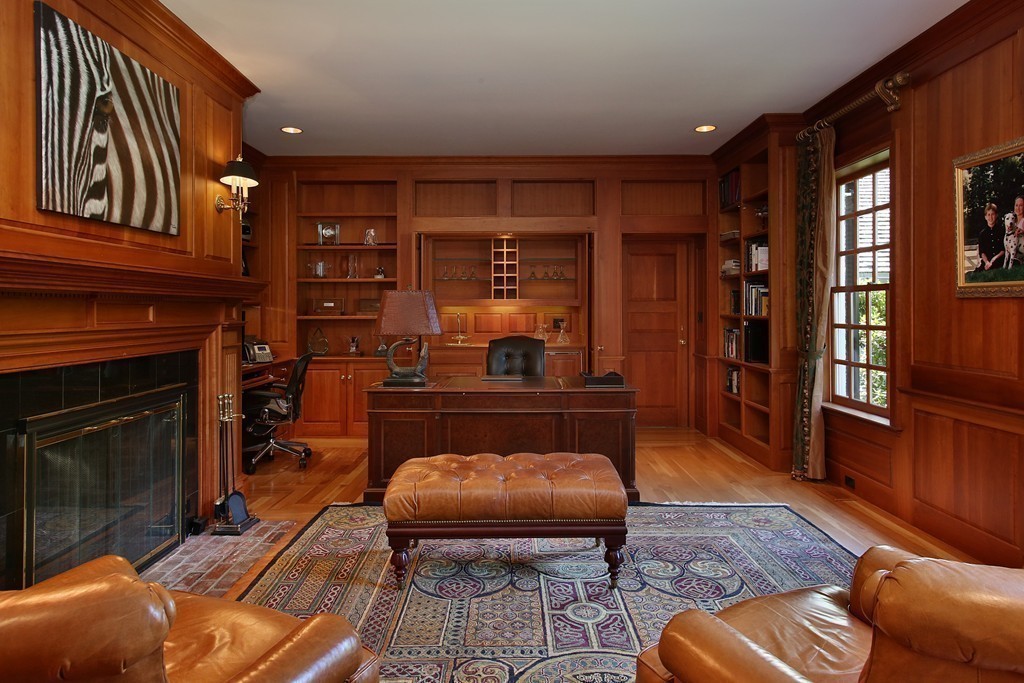 466 Glen Road Weston, MA 02493 - Photo 6 of 27 a living room with furniture a rug and a fireplace