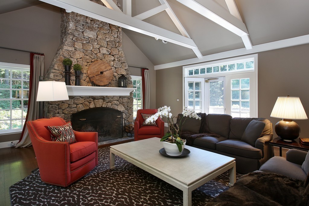 466 Glen Road Weston, MA 02493 - Photo 8 of 27 a living room with furniture a table and a fireplace