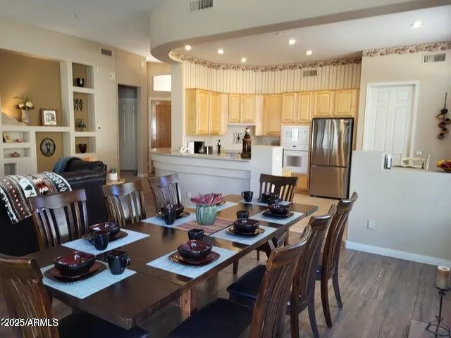 a kitchen with a dining table and chairs