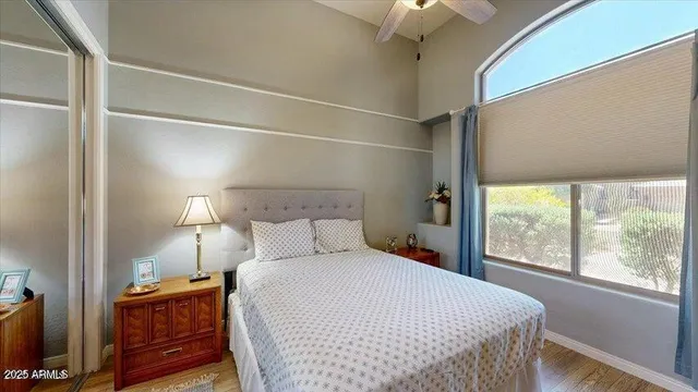 a bedroom with a bed and a window