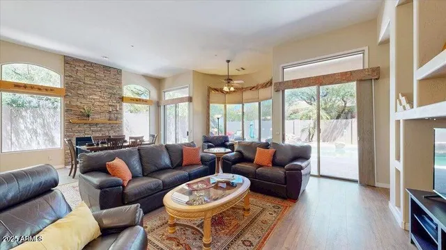 a living room with furniture and a large window