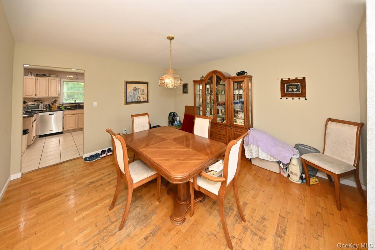 14 Roble Road Suffern, NY 10901 - Photo 15 of 30 Dining space with light wood finished floors and a chandelier