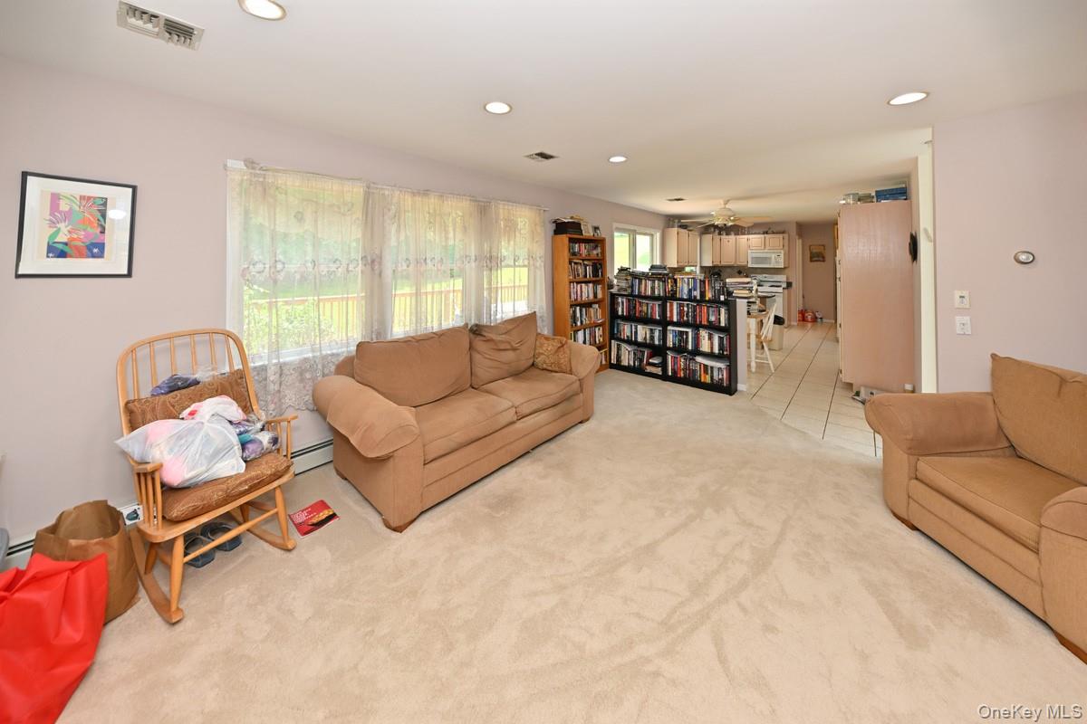 14 Roble Road Suffern, NY 10901 - Photo 18 of 30 Living room with recessed lighting, carpet flooring, and a baseboard radiator